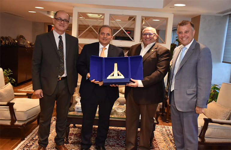 The President of Ain Shams University honors the President of the National Bank of Egypt