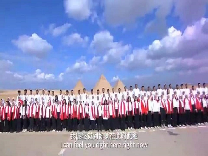 Under the foot of the pyramids and in front of Zafaran Palace... Ain Shams University choir sings a song for the 2022 Beijing Winter Olympics