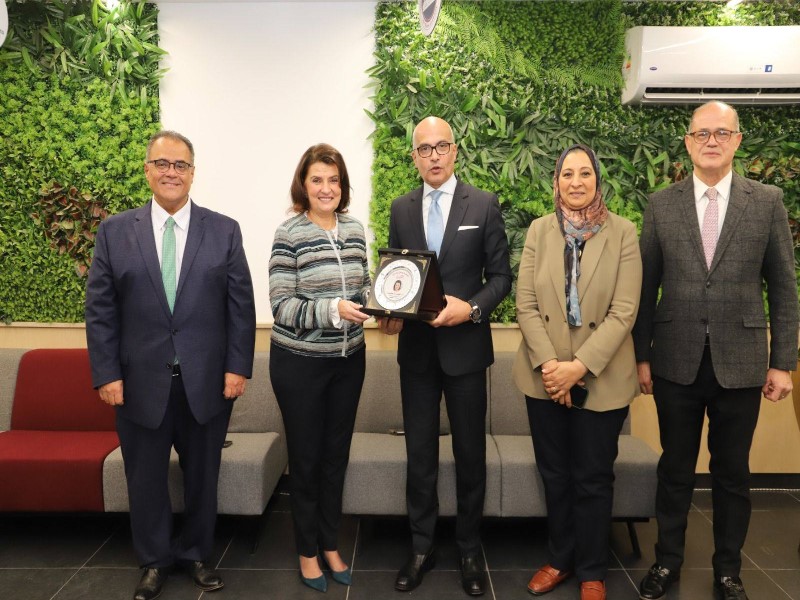 The President of Ain Shams University honors the Executive Director of the International Relations Sector and the Director of the Grants and Projects Department in appreciation of their efforts in developing the International Relations Sector