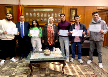 The Students of the Faculty of Al-Alsun complete a training program at the Arabic booth at the United Nations headquarters in Vienna